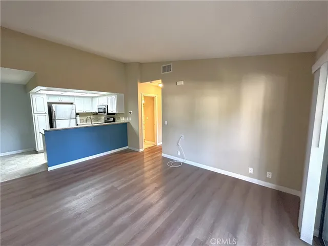 a view of kitchen with wooden floor