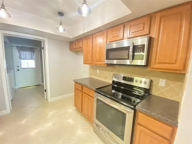 a utility room with sink dryer and washer