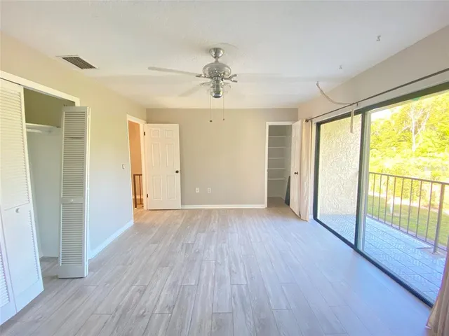 an empty room with a fan