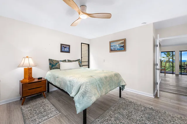 a bedroom with a bed and a lamp on table