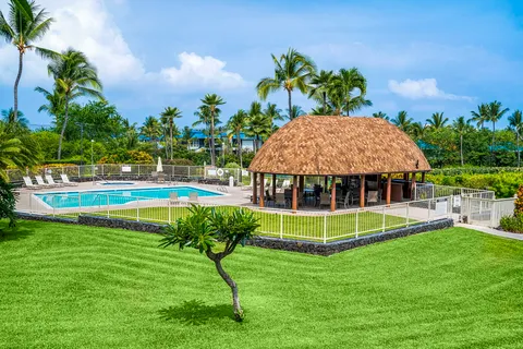 a view of a house with a backyard porch and sitting area