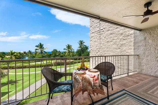 a view of a chairs and table in patio