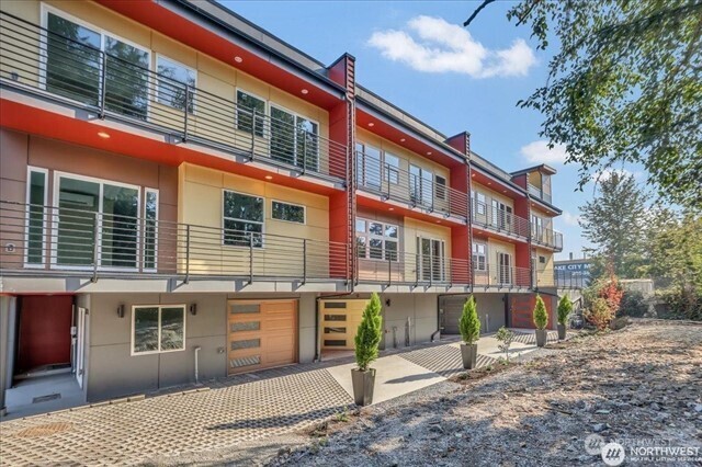 3117 Northeast 133rd Street, Unit D Seattle, WA 98125 - Photo 1 of 22 a front view of a building