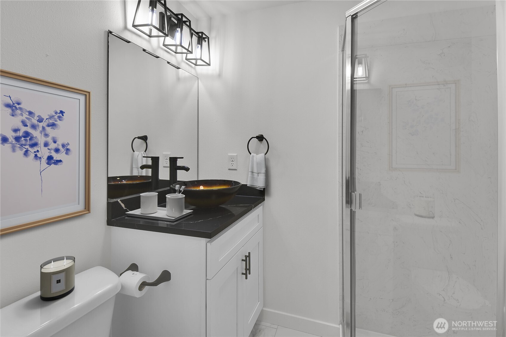 3117 Northeast 133rd Street, Unit D Seattle, WA 98125 - Photo 14 of 22 a bathroom with a sink and a mirror