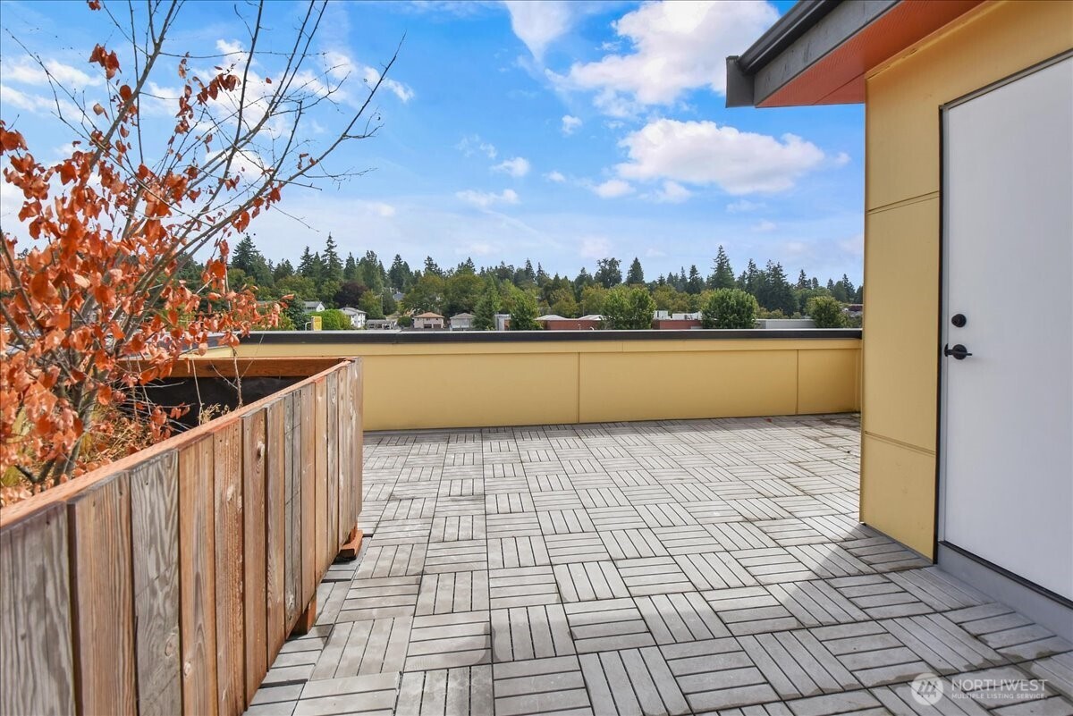 3117 Northeast 133rd Street, Unit D Seattle, WA 98125 - Photo 19 of 22 a view of terrace with skyline