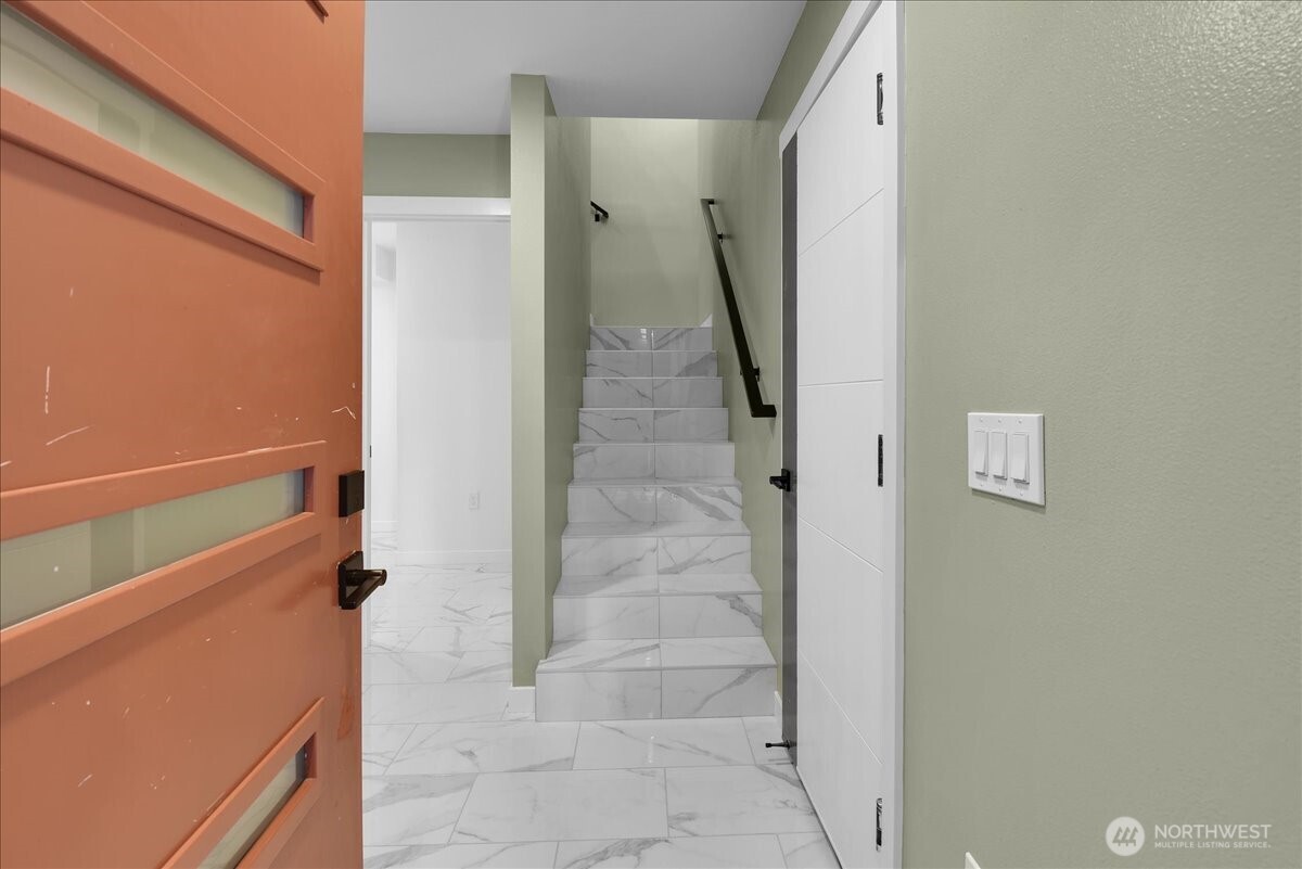 3117 Northeast 133rd Street, Unit D Seattle, WA 98125 - Photo 22 of 22 a view of a hallway with stairs