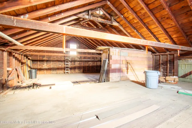a view of a room with wooden walls