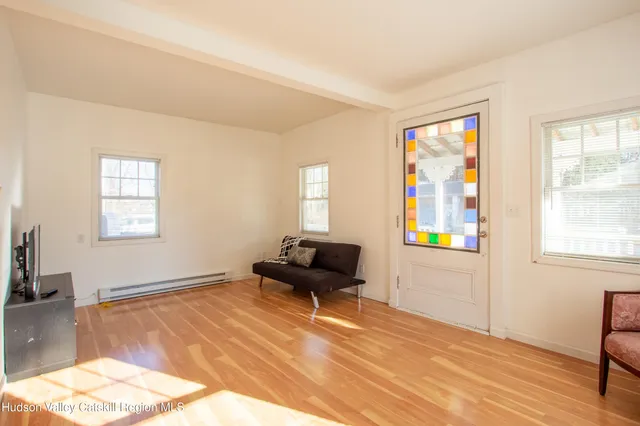 a living room with furniture and a window