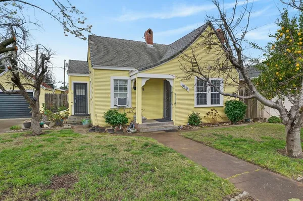 front view of a house with a yard