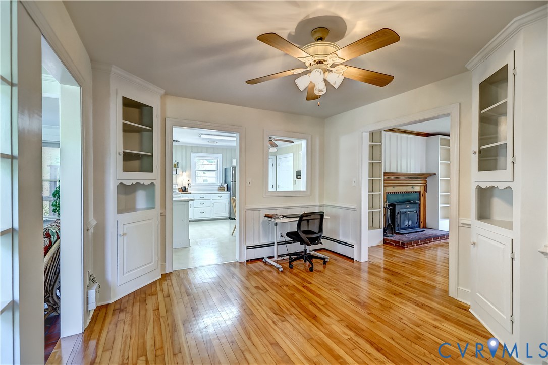 1817 Pocoshock Boulevard North Chesterfield, VA 23235 - Photo 12 of 41 a view of a livingroom with wooden floor and a ceiling fan