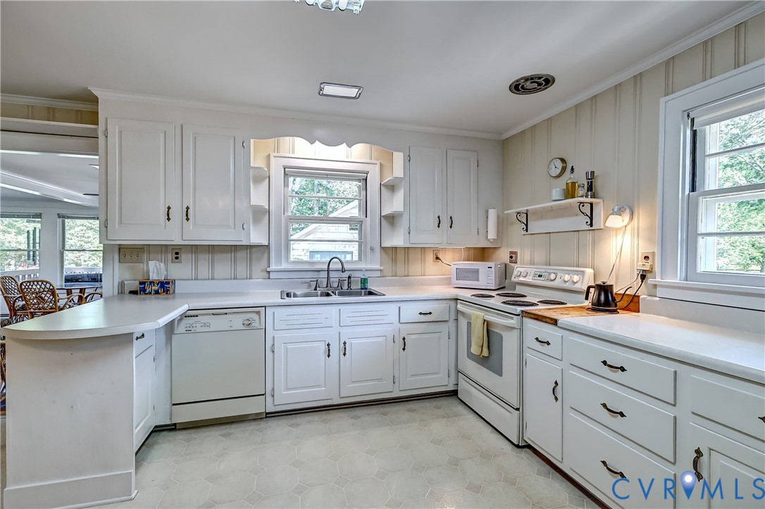 1817 Pocoshock Boulevard North Chesterfield, VA 23235 - Photo 21 of 41 a kitchen with sink cabinets and window