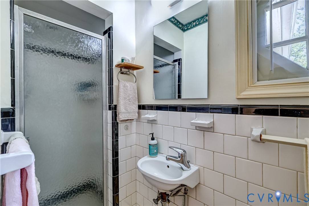 1817 Pocoshock Boulevard North Chesterfield, VA 23235 - Photo 24 of 41 a bathroom with a sink and a mirror