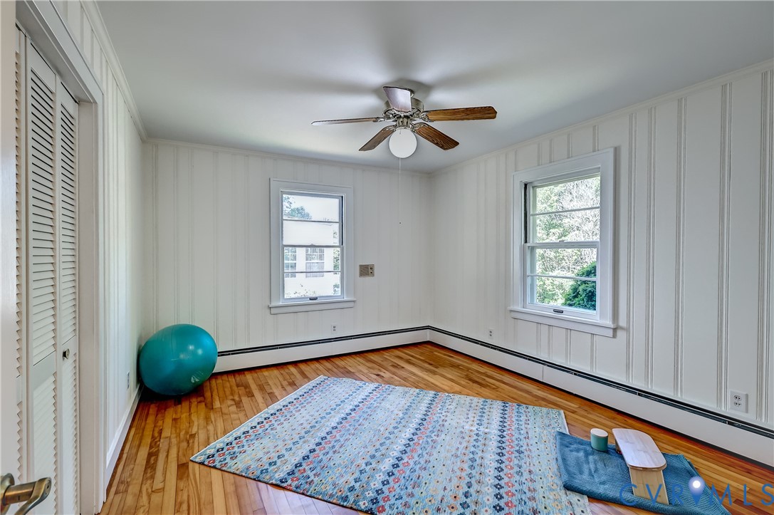 1817 Pocoshock Boulevard North Chesterfield, VA 23235 - Photo 26 of 41 a view of a livingroom with wooden floor and a ceiling fan