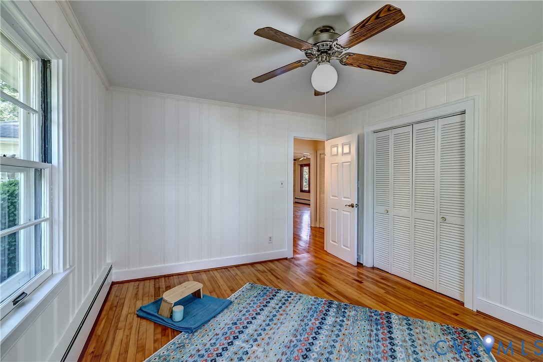 1817 Pocoshock Boulevard North Chesterfield, VA 23235 - Photo 27 of 41 a view of bedroom with a bed and wooden floor