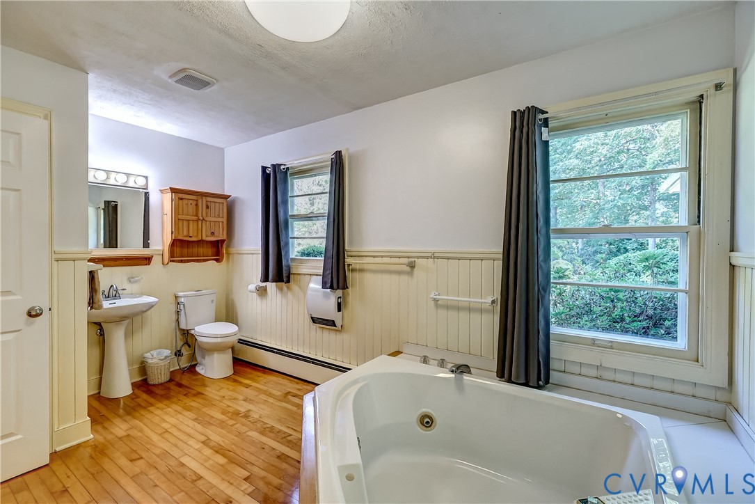 1817 Pocoshock Boulevard North Chesterfield, VA 23235 - Photo 28 of 41 a bathroom with a tub sink and mirror
