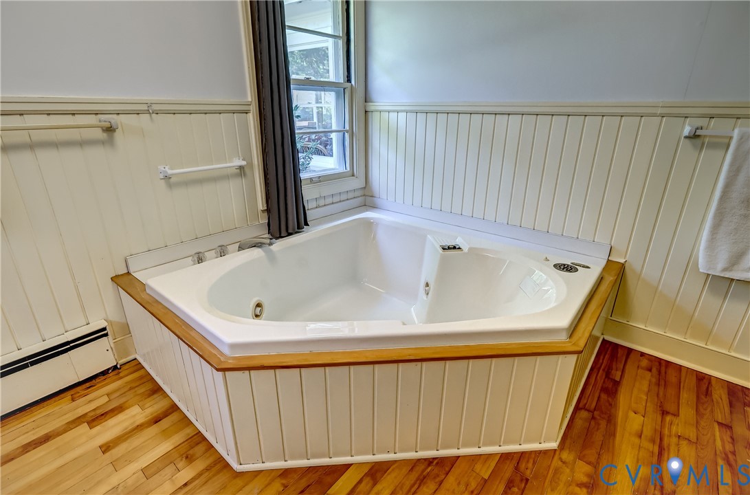 1817 Pocoshock Boulevard North Chesterfield, VA 23235 - Photo 29 of 41 a bathroom with a tub and shower