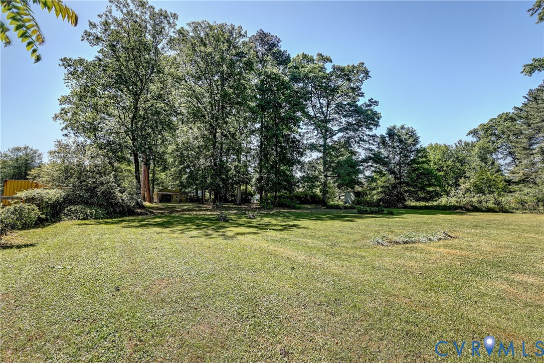 1817 Pocoshock Boulevard North Chesterfield, VA 23235 - Photo 4 of 41 a view of a yard with an trees