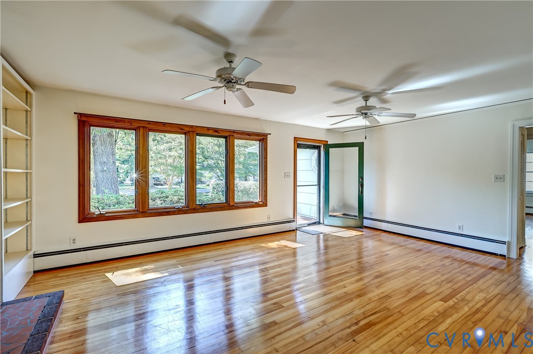 1817 Pocoshock Boulevard North Chesterfield, VA 23235 - Photo 9 of 41 a view of an empty room with wooden floor and a window
