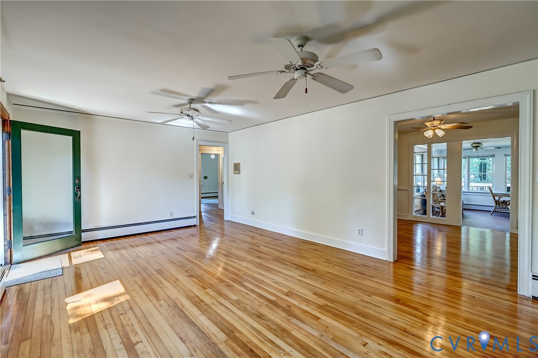 1817 Pocoshock Boulevard North Chesterfield, VA 23235 - Photo 10 of 41 wooden floor in an empty room with a window