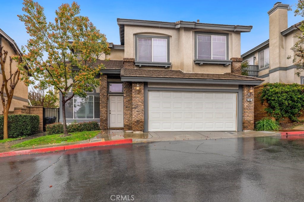 7562 Rio Del Sol Place Rancho Cucamonga, CA 91730 - Photo 1 of 1 a view of the house with a yard and garage