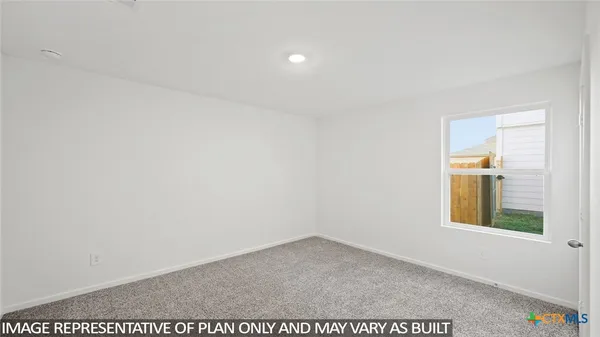 a view of an empty room and window