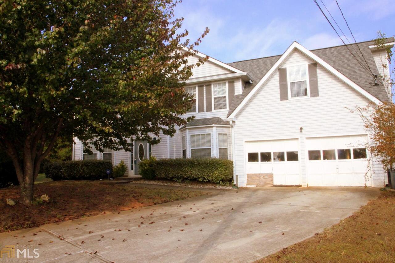 2041 Redwater Drive, Unit 198 Decatur, GA 30035 - Photo 1 of 1 a view of a big house with a yard and large trees