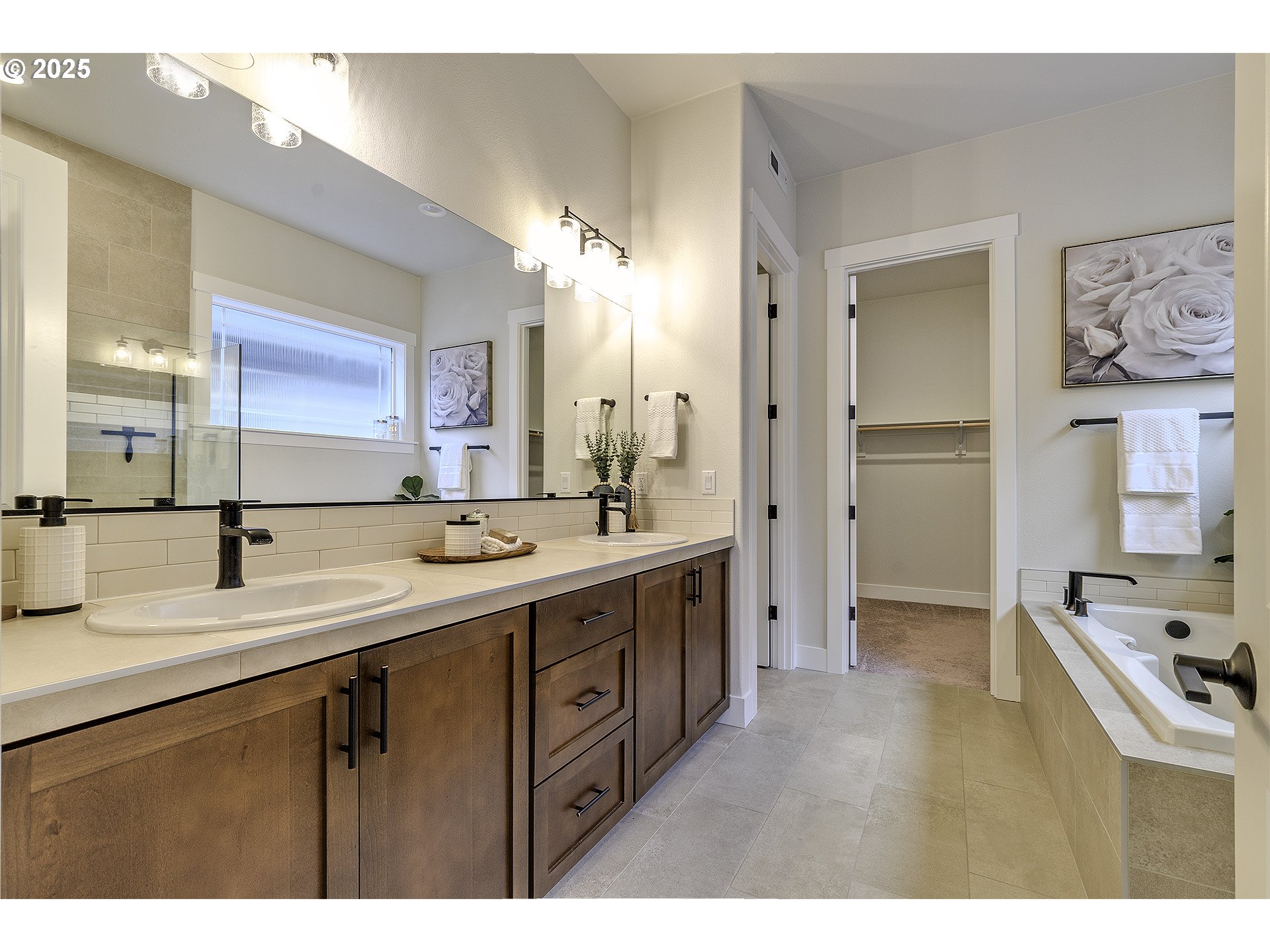 29068 Northwest Fair Street North Plains, OR 97133 - Photo 19 of 29 a bathroom with a double vanity sink a mirror and a shower