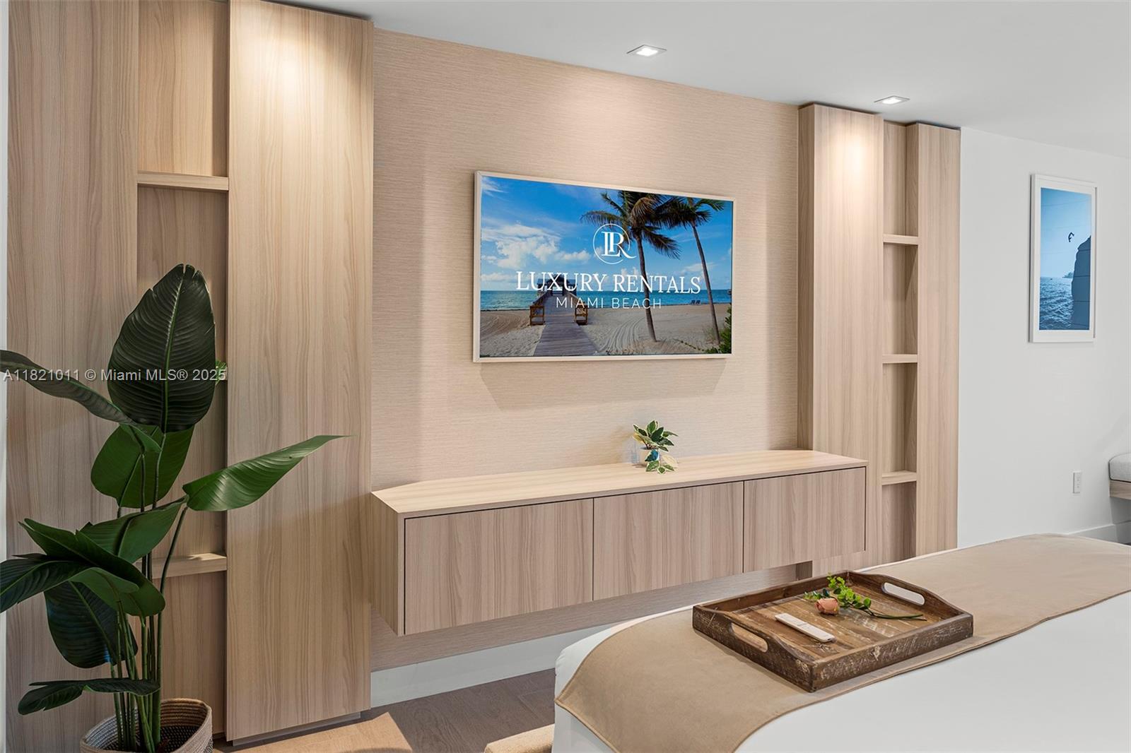 2301 Collins Avenue, Unit 630 Miami Beach, FL 33139 - Photo 15 of 48 a bedroom with a bed and a painting on the wall