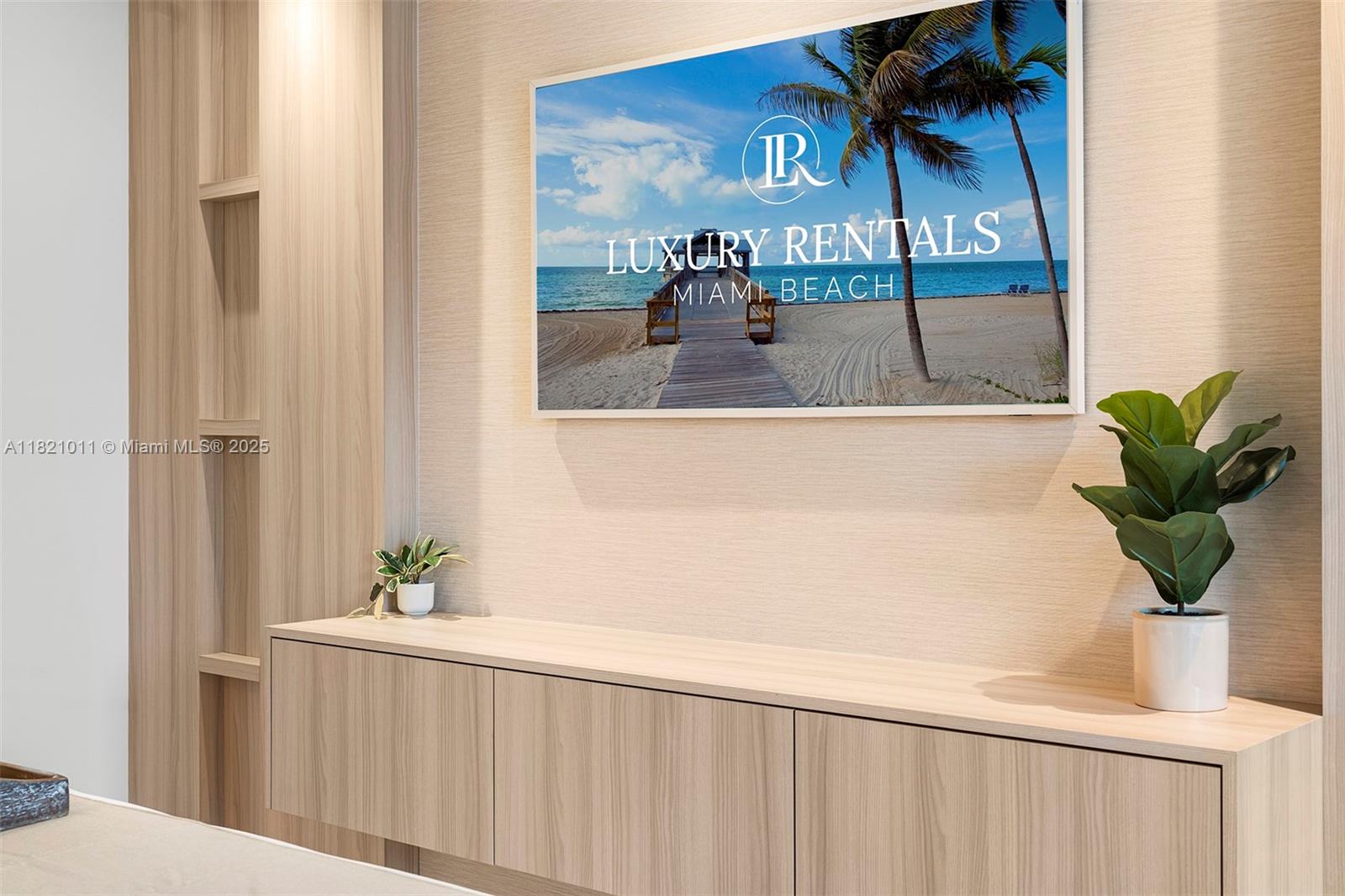 2301 Collins Avenue, Unit 630 Miami Beach, FL 33139 - Photo 17 of 48 a potted plant sitting on top of a wooden wall