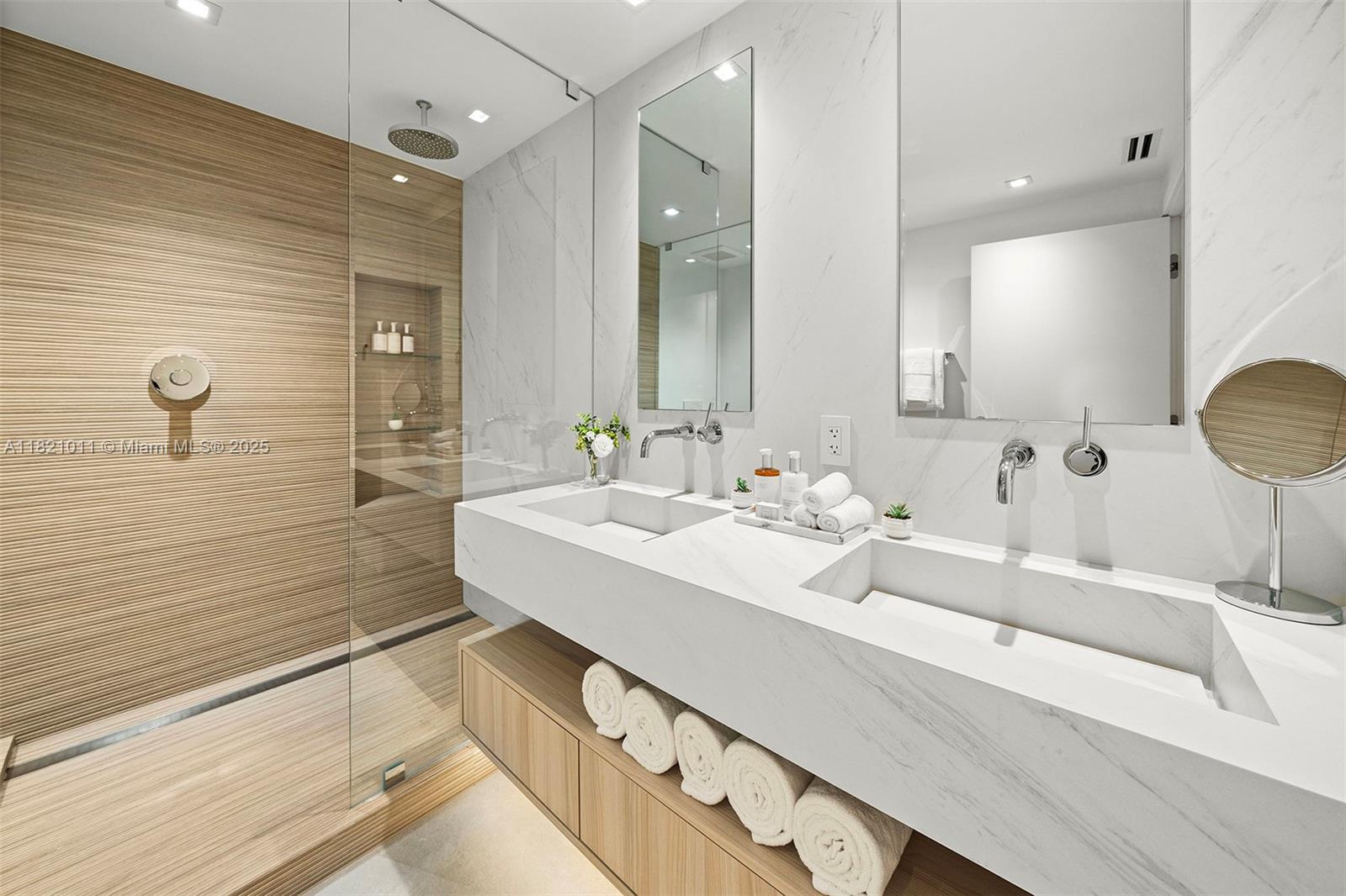 2301 Collins Avenue, Unit 630 Miami Beach, FL 33139 - Photo 22 of 48 a bathroom with double vanity sink and a mirror