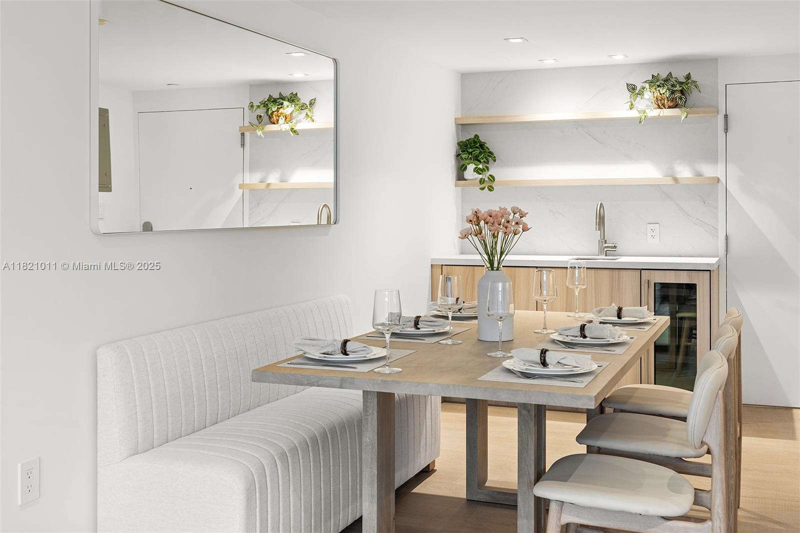2301 Collins Avenue, Unit 630 Miami Beach, FL 33139 - Photo 27 of 48 a view of a dining room with furniture and wooden floor