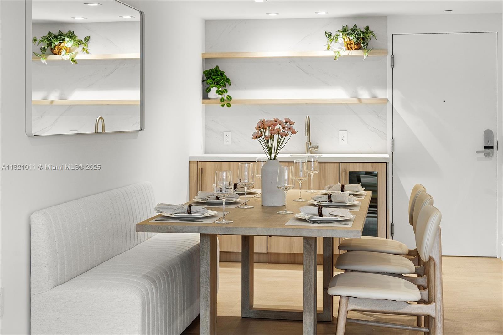 2301 Collins Avenue, Unit 630 Miami Beach, FL 33139 - Photo 28 of 48 a dining room with furniture and wooden floor