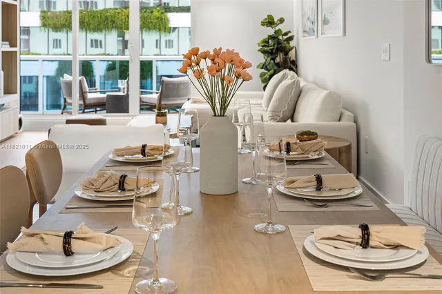 a dining room with table and chairs
