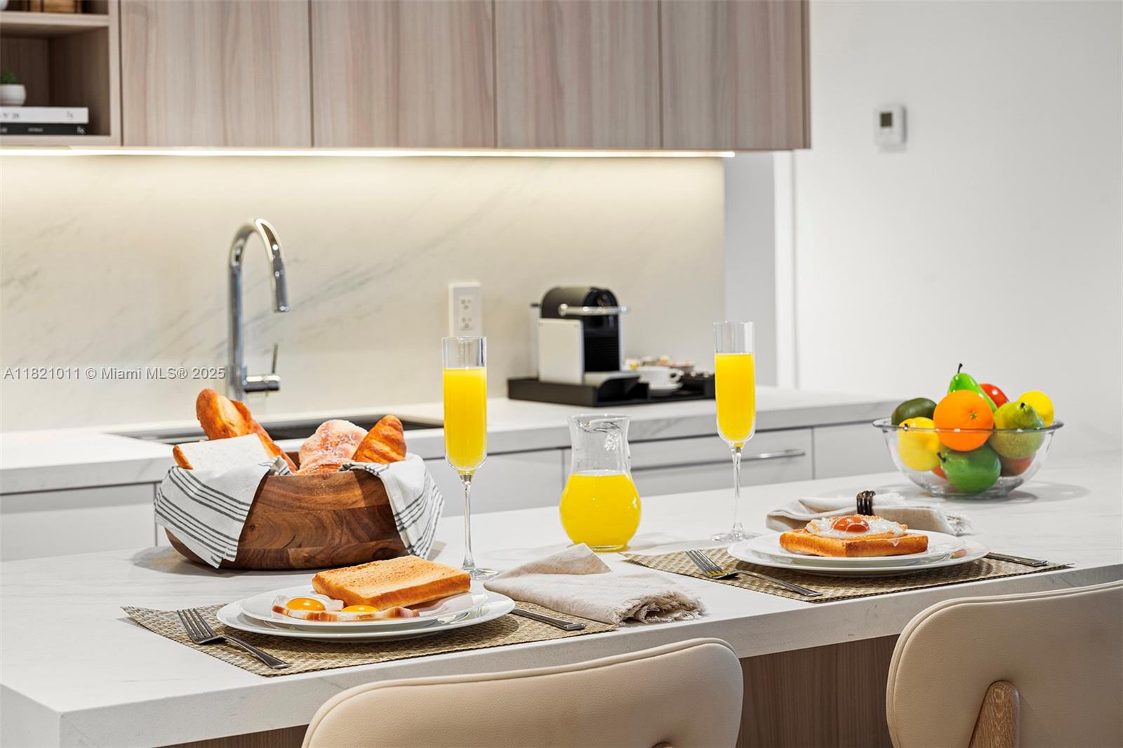 2301 Collins Avenue, Unit 630 Miami Beach, FL 33139 - Photo 34 of 48 a kitchen with a sink and a stove