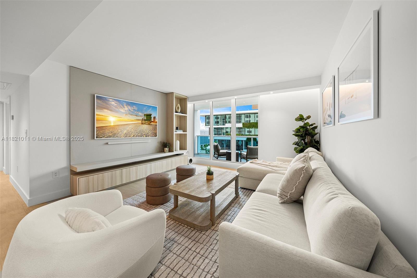 2301 Collins Avenue, Unit 630 Miami Beach, FL 33139 - Photo 38 of 48 a living room with furniture and a flat screen tv