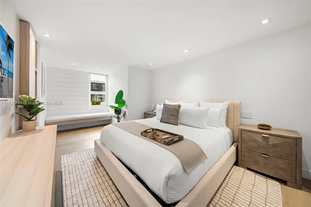 a bedroom with bed and window