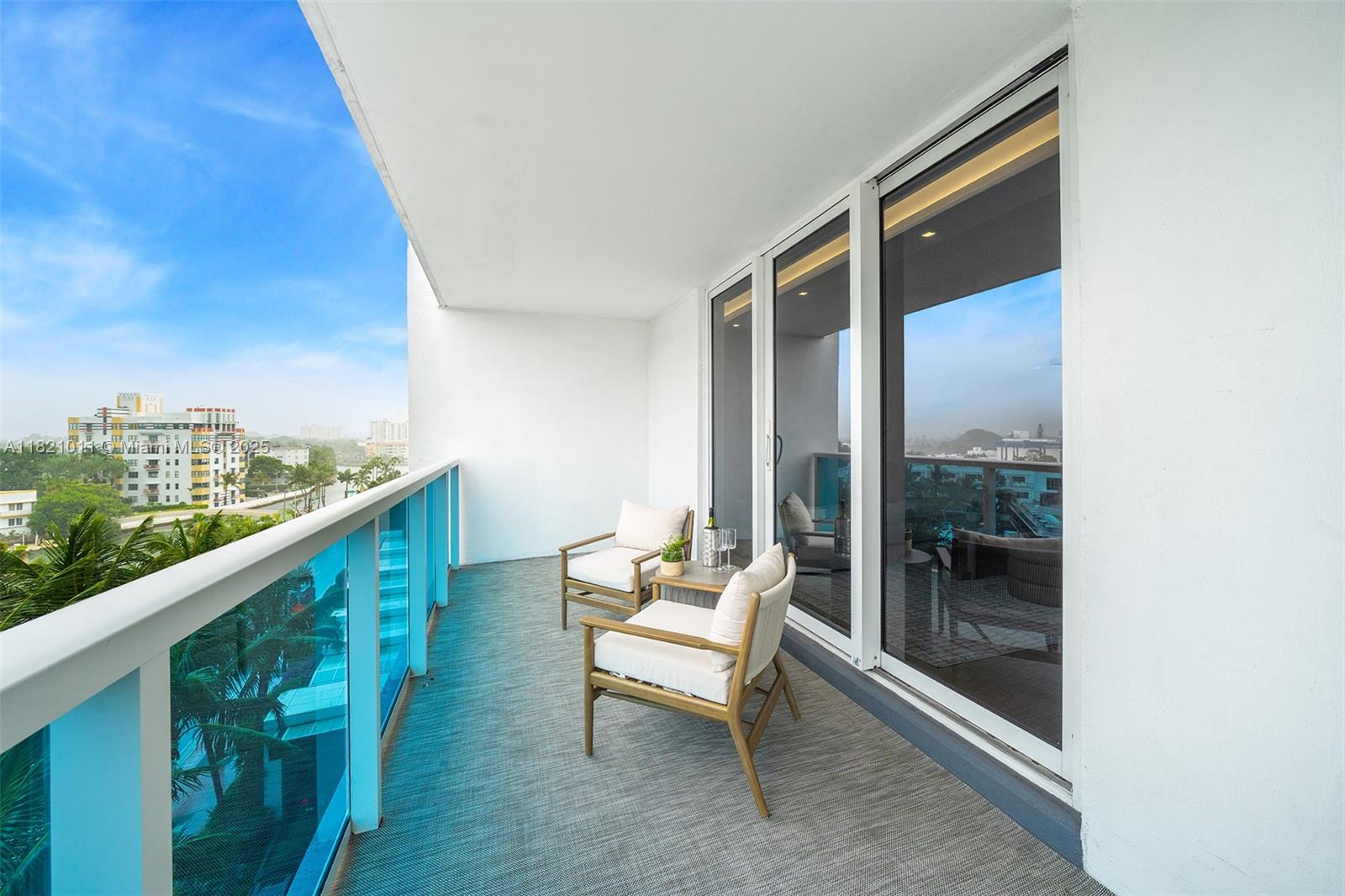 2301 Collins Avenue, Unit 630 Miami Beach, FL 33139 - Photo 43 of 48 a balcony with chairs and bench