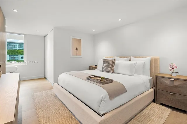 a bedroom with a large bed and a couch