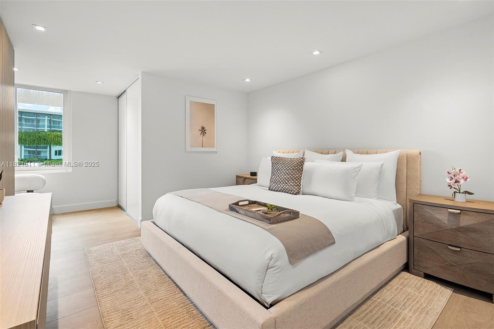 2301 Collins Avenue, Unit 630 Miami Beach, FL 33139 - Photo 6 of 48 a bedroom with a large bed and a couch