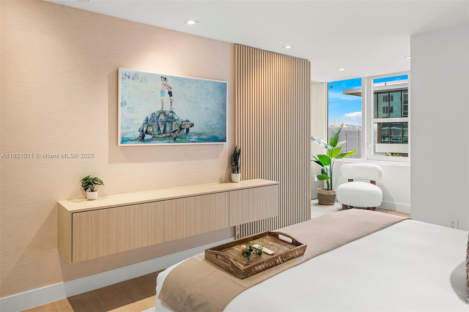 2301 Collins Avenue, Unit 630 Miami Beach, FL 33139 - Photo 8 of 48 a bedroom with a bed and a painting on the wall