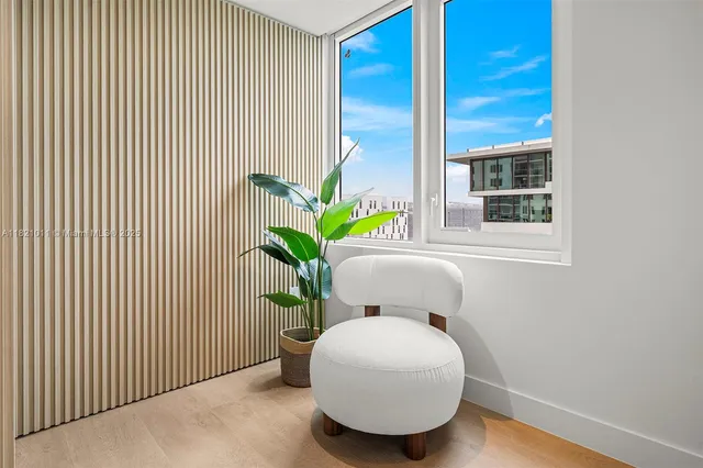 a potted plant sitting in front of a door
