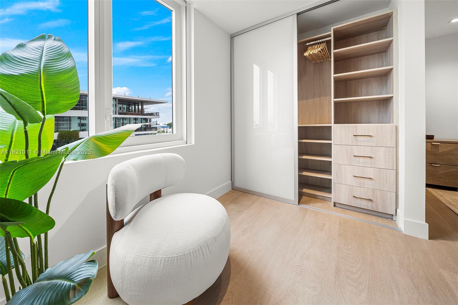 2301 Collins Avenue, Unit 630 Miami Beach, FL 33139 - Photo 10 of 48 a living room with furniture and a closet