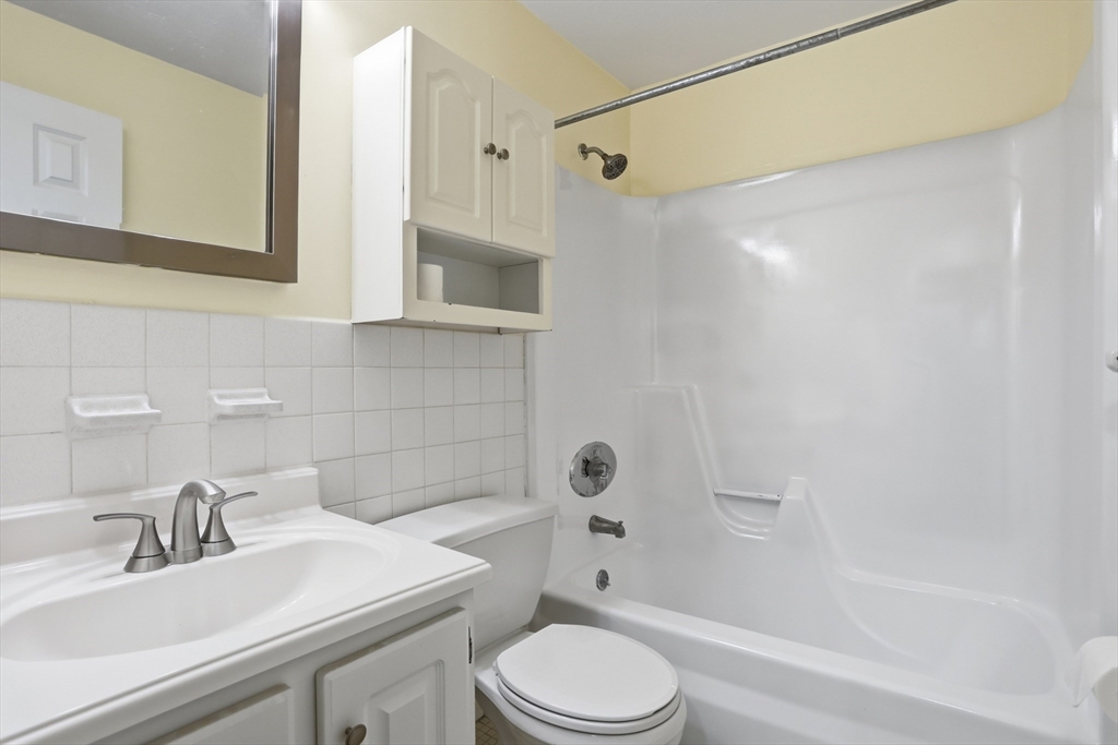 209 Great Road, Unit C3 Acton, MA 01720 - Photo 13 of 24 a bathroom with a sink toilet vanity and shower