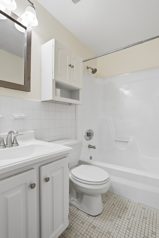 209 Great Road, Unit C3 Acton, MA 01720 - Photo 14 of 24 a bathroom with a sink a toilet and a mirror