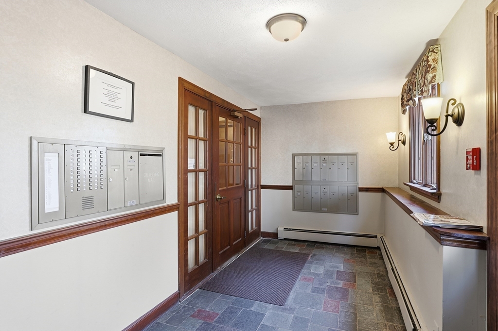 209 Great Road, Unit C3 Acton, MA 01720 - Photo 18 of 24 a view of a hallway to rooms and stairs