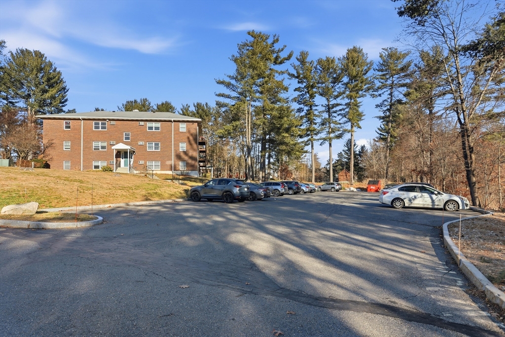 209 Great Road, Unit C3 Acton, MA 01720 - Photo 23 of 24 a view of city street with residential houses