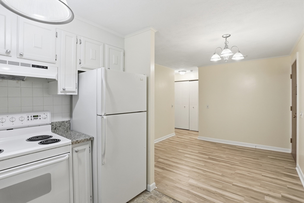 209 Great Road, Unit C3 Acton, MA 01720 - Photo 7 of 24 a white refrigerator freezer sitting inside of a kitchen