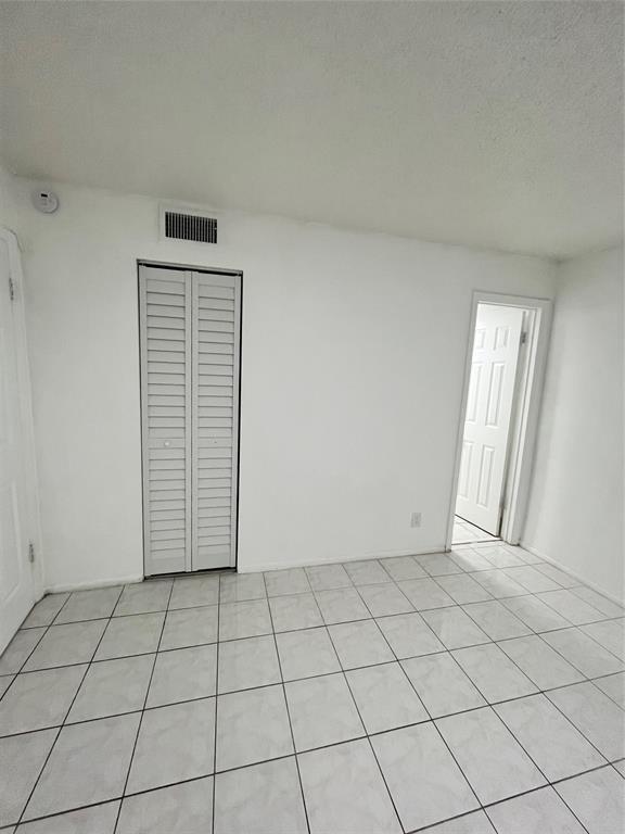 7925 Fairview Drive, Unit 101 Tamarac, FL 33321 - Photo 12 of 48 a view of an empty room and window