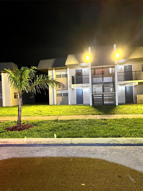 7925 Fairview Drive, Unit 101 Tamarac, FL 33321 - Photo 13 of 48 a view of a swimming pool with a yard