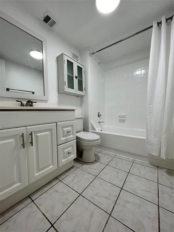 7925 Fairview Drive, Unit 101 Tamarac, FL 33321 - Photo 23 of 48 a bathroom with a sink a toilet and a mirror
